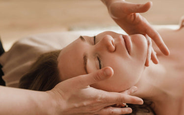 Woman receiving a face massage.