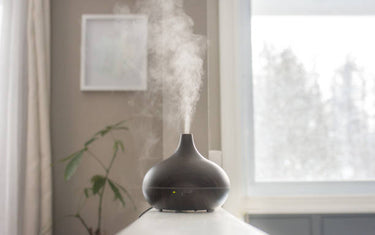 Diffuser with steam coming out of it on a shelf