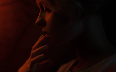 Woman touching her lip.