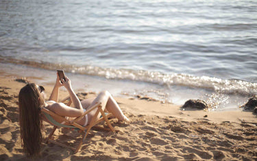 Woman tanning on the beach.
