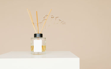 Reed diffuser on a white countertop
