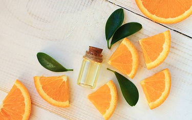 Seven slices of orange lined up in a circular pattern.