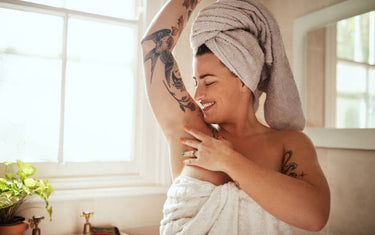 Woman facing backward with her arms in the air