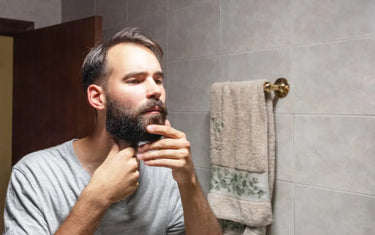 Man tidying up his beard 