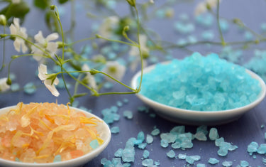 Orange and blue bath salts made with essential oils.