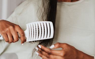 Woman brushing her hair