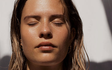 Close up of woman's face with eyes closed