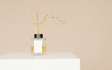 Reed diffuser on a white countertop