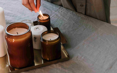 Collection of candles on a tray.