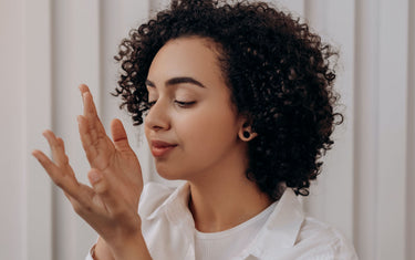 Woman smelling her hands