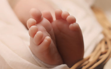 Baby's feet in a basket. 
