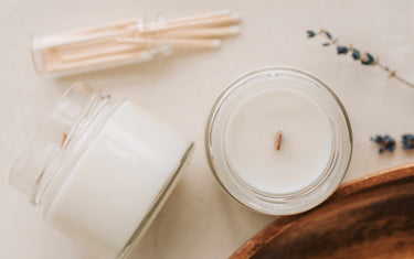 Two soy candles on a table.