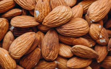 Several almonds in a pile.