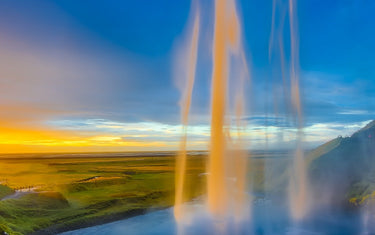 Waterfall with sunset in background.